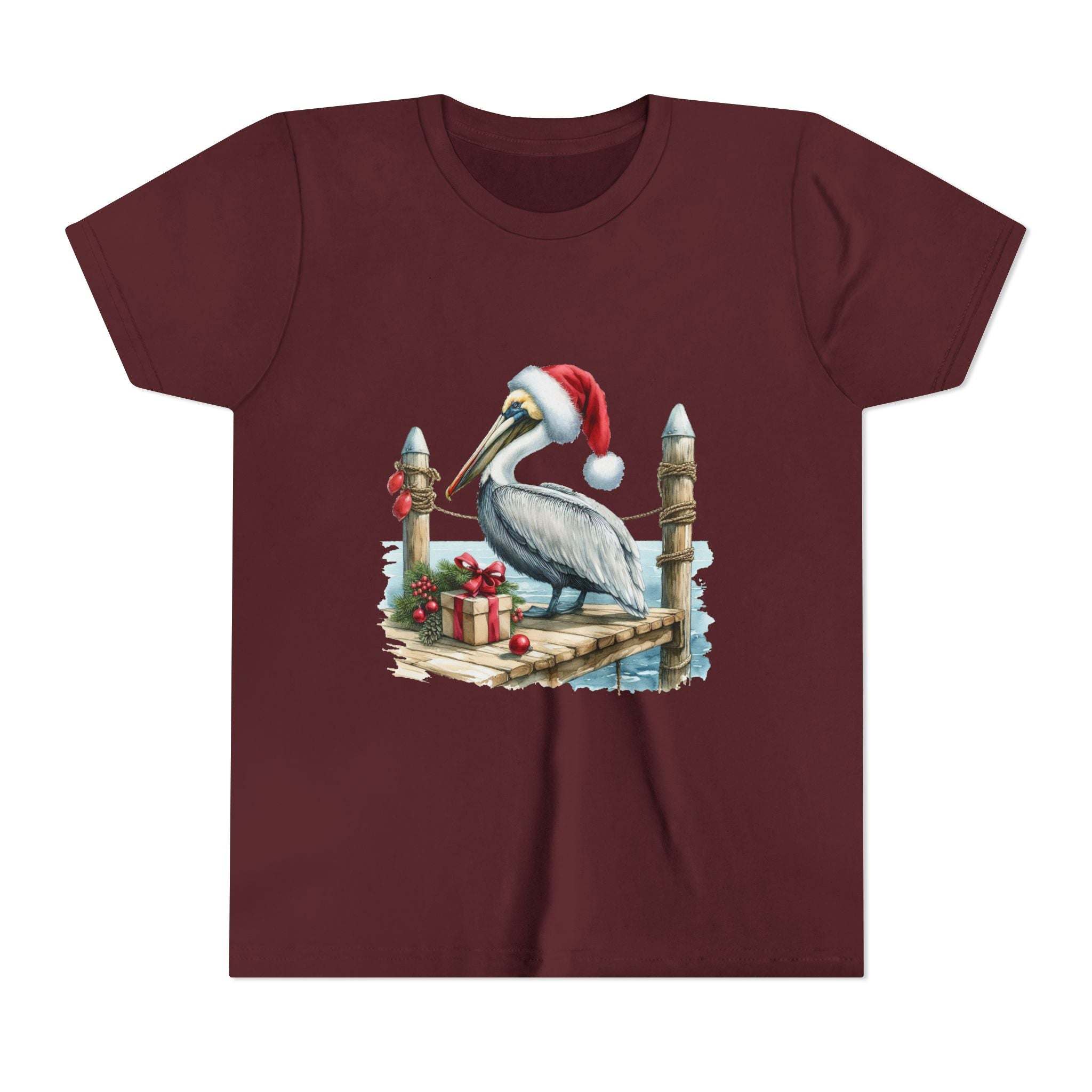 Maroon t-shirt with a Christmas pelican design on a white background