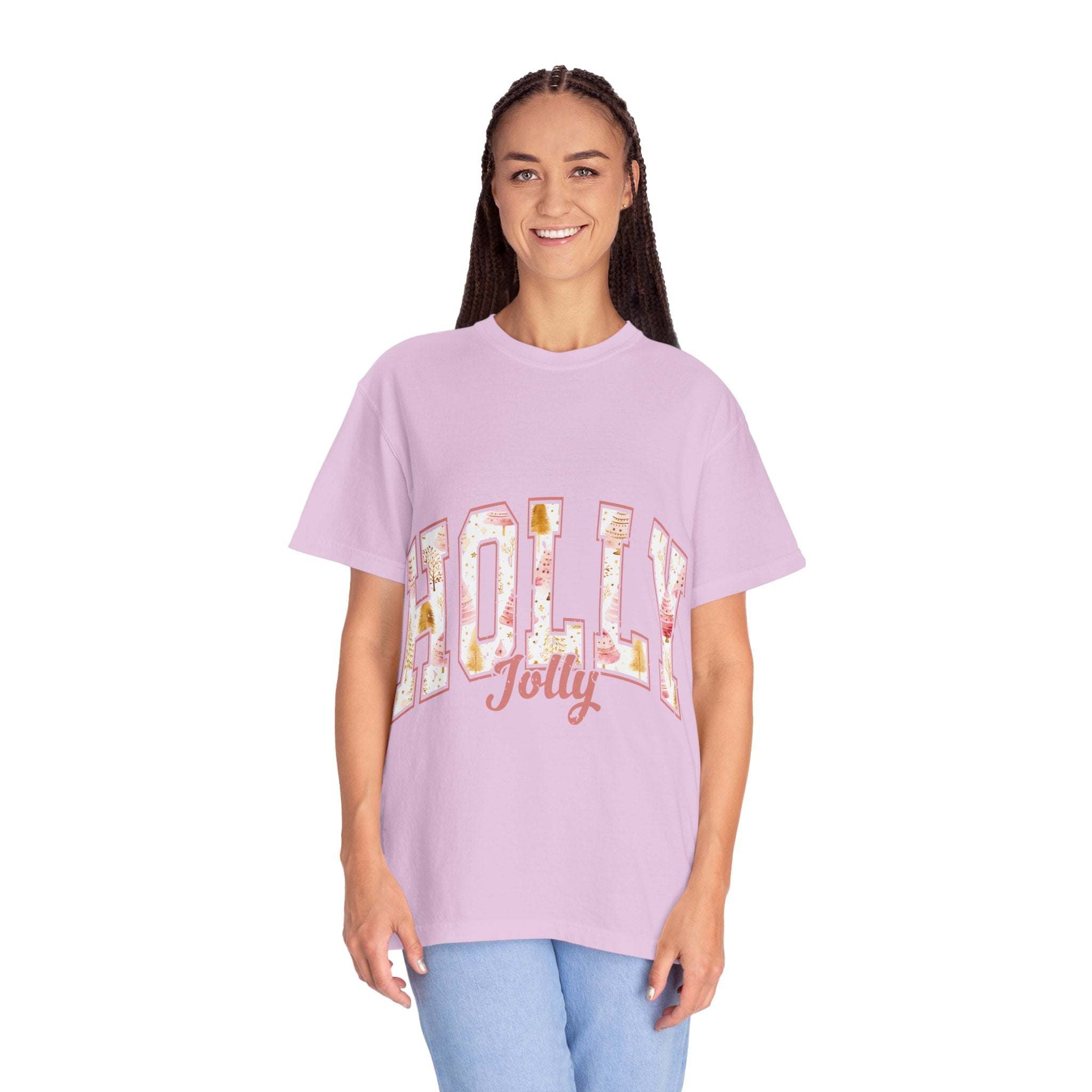 Woman wearing lavender Varsity Holly Jolly T-shirt with festive text, relaxed fit and garment-dyed cotton fabric