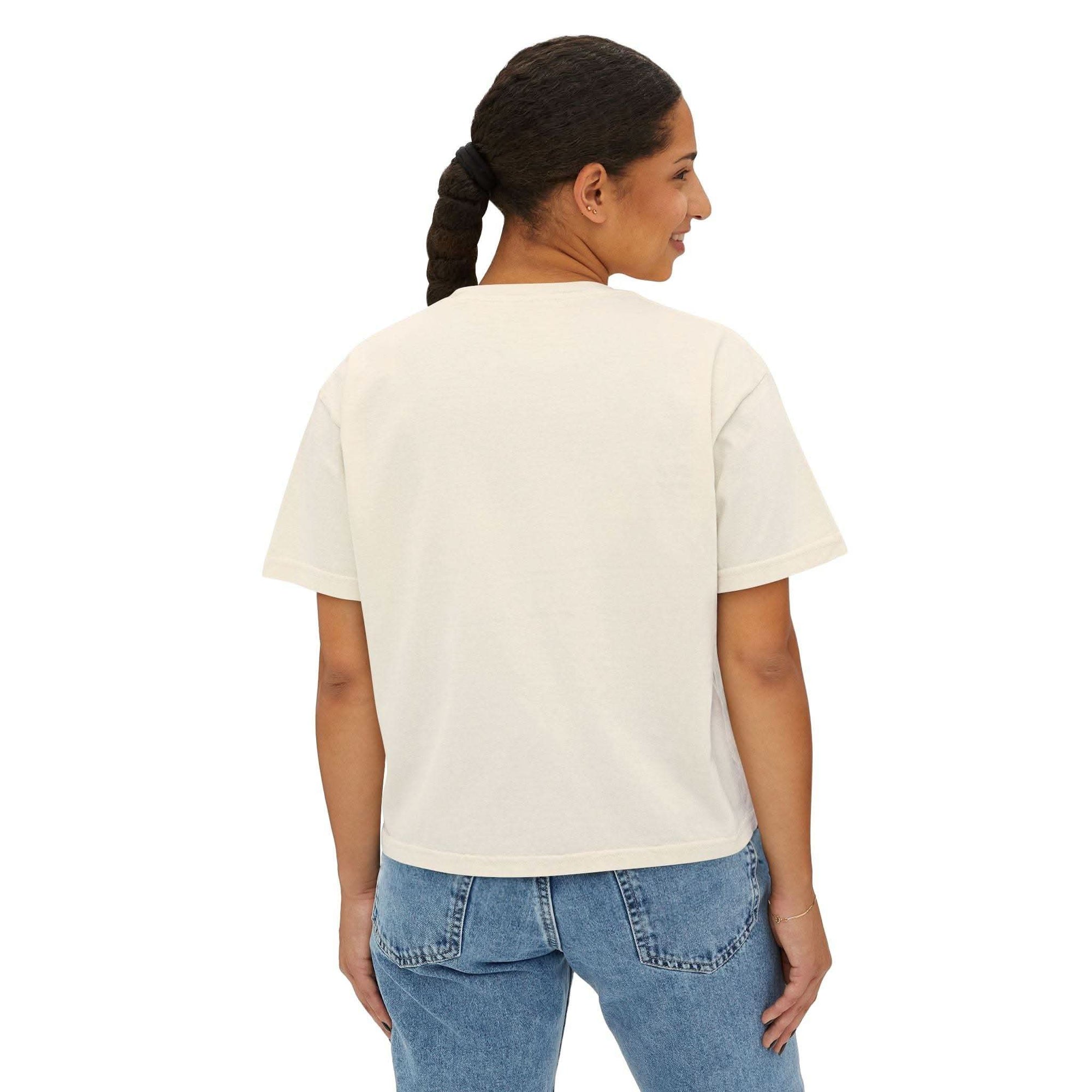 Back view of woman wearing Tee Blessed be the Peacemakers women's boxy shirt in cream color with blue jeans