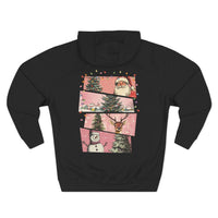 Black fleece hoodie with pink Christmas watercolor swatches featuring Santa, trees, reindeer, and snowman design