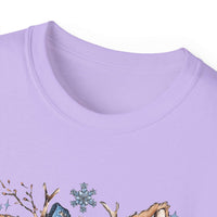 White t-shirt with retro patchwork reindeer design wearing blue scarf and surrounded by snowflakes