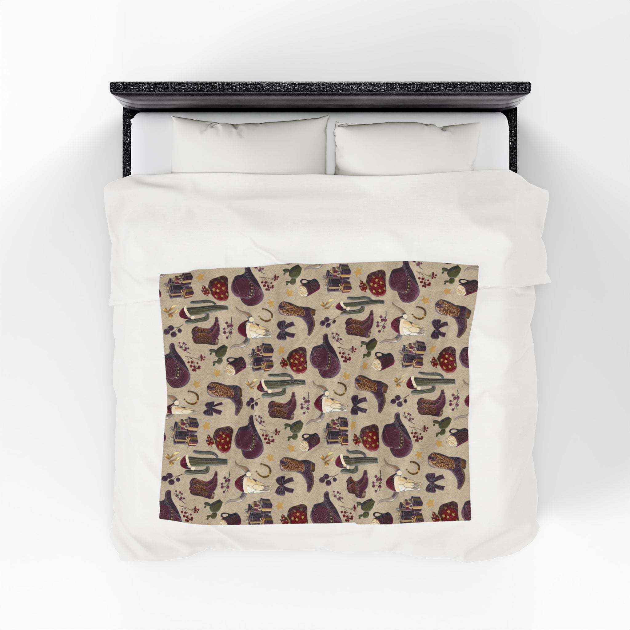 Cowboy Christmas design plush blanket with soft velveteen fabric and vibrant patterns on bed