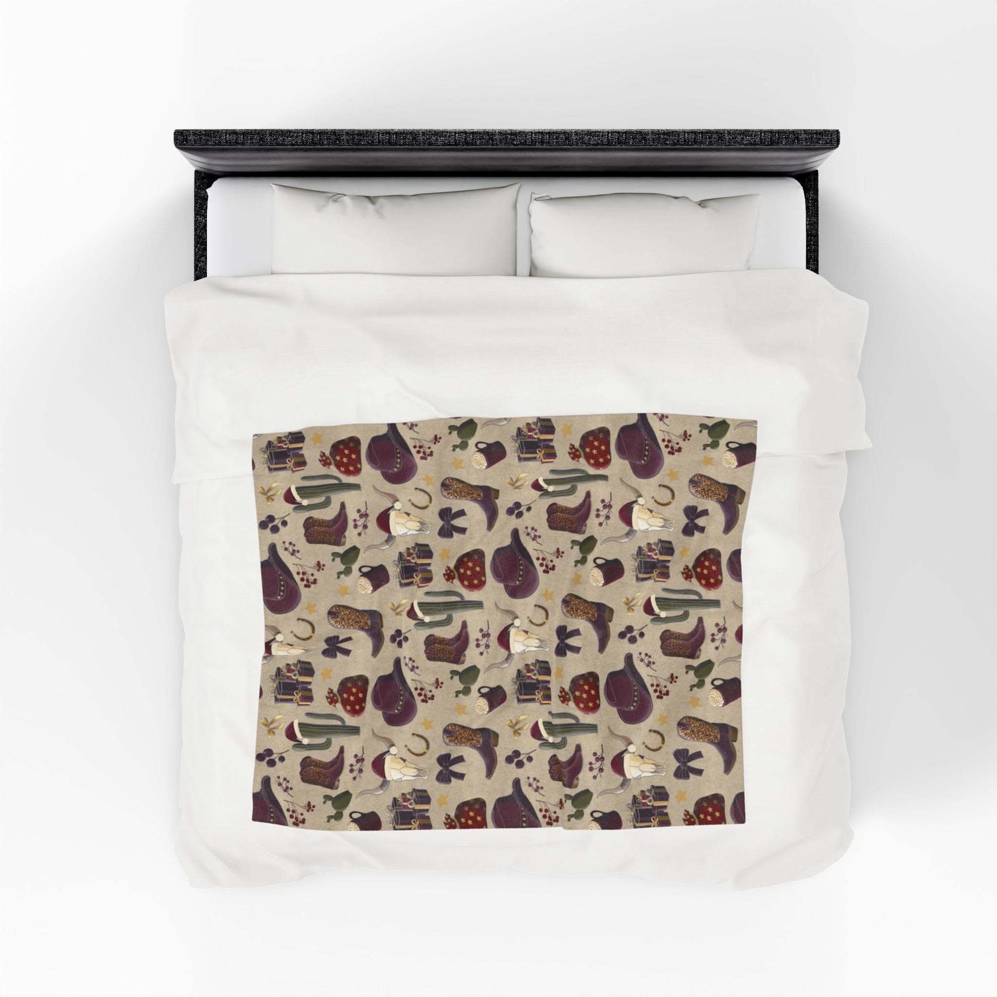 Cowboy Christmas design plush blanket with soft velveteen fabric and vibrant patterns on bed