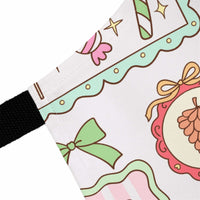 Close-up of Retro Christmas Frames and Bows apron with festive bow and candy cane design on polyester fabric