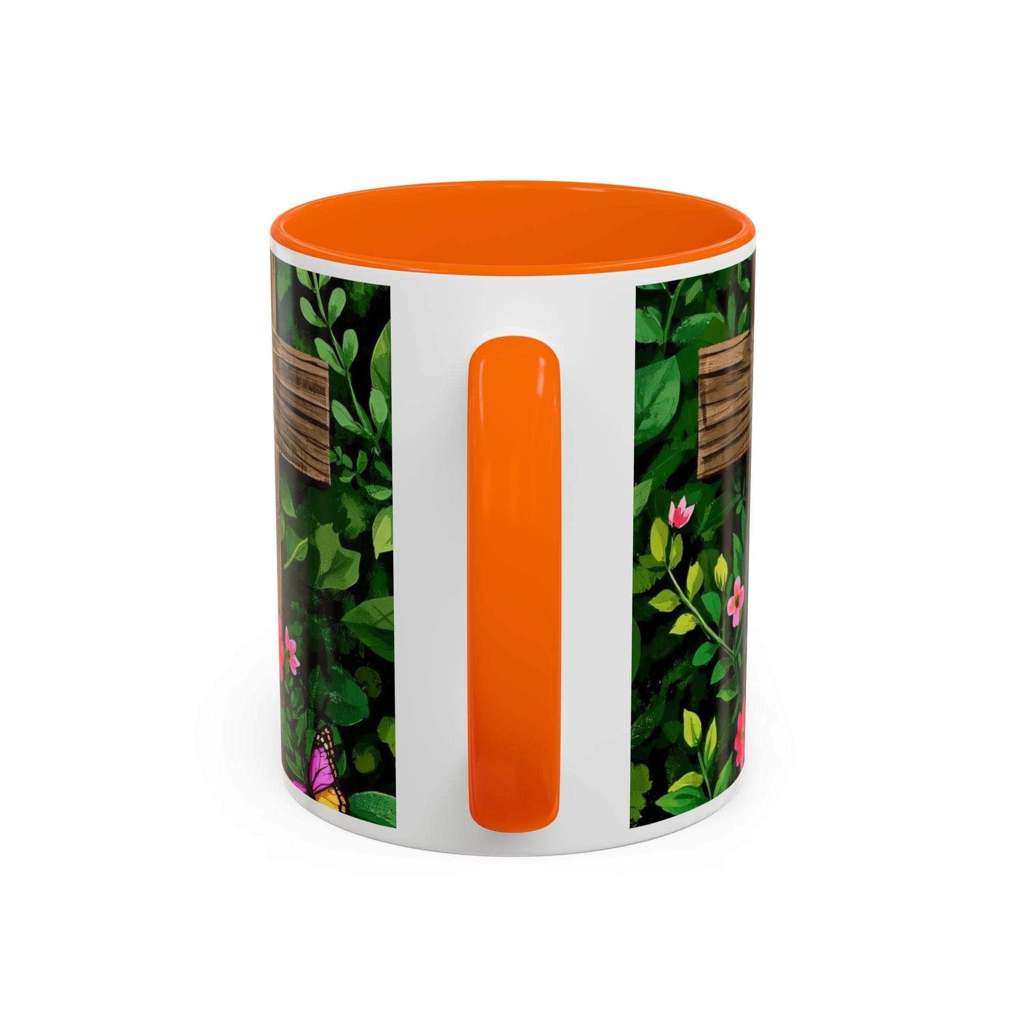 Mug with floral pattern and orange interior on a white background