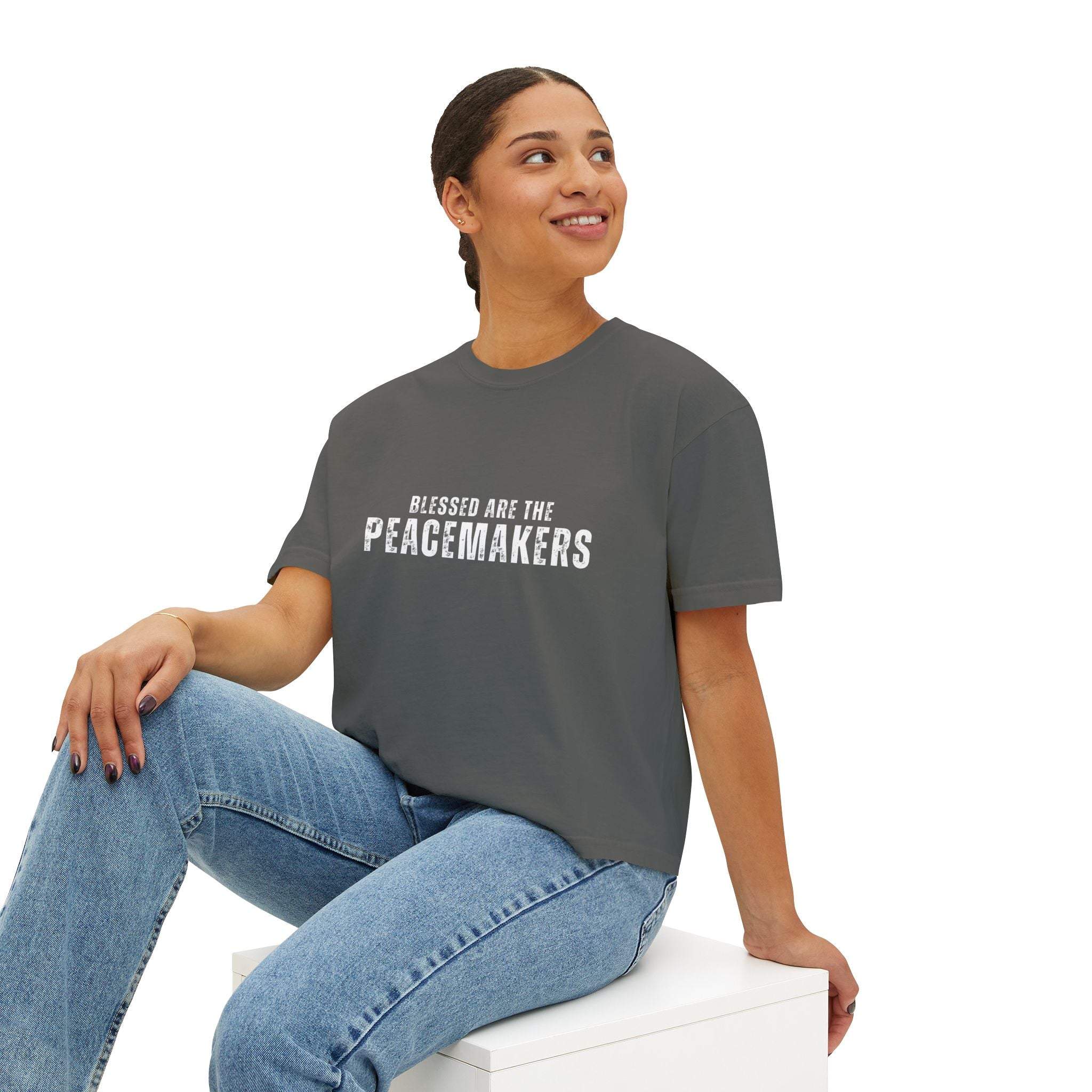 Women's boxy grey tee with "Blessed be the Peacemakers" text, casual vintage style