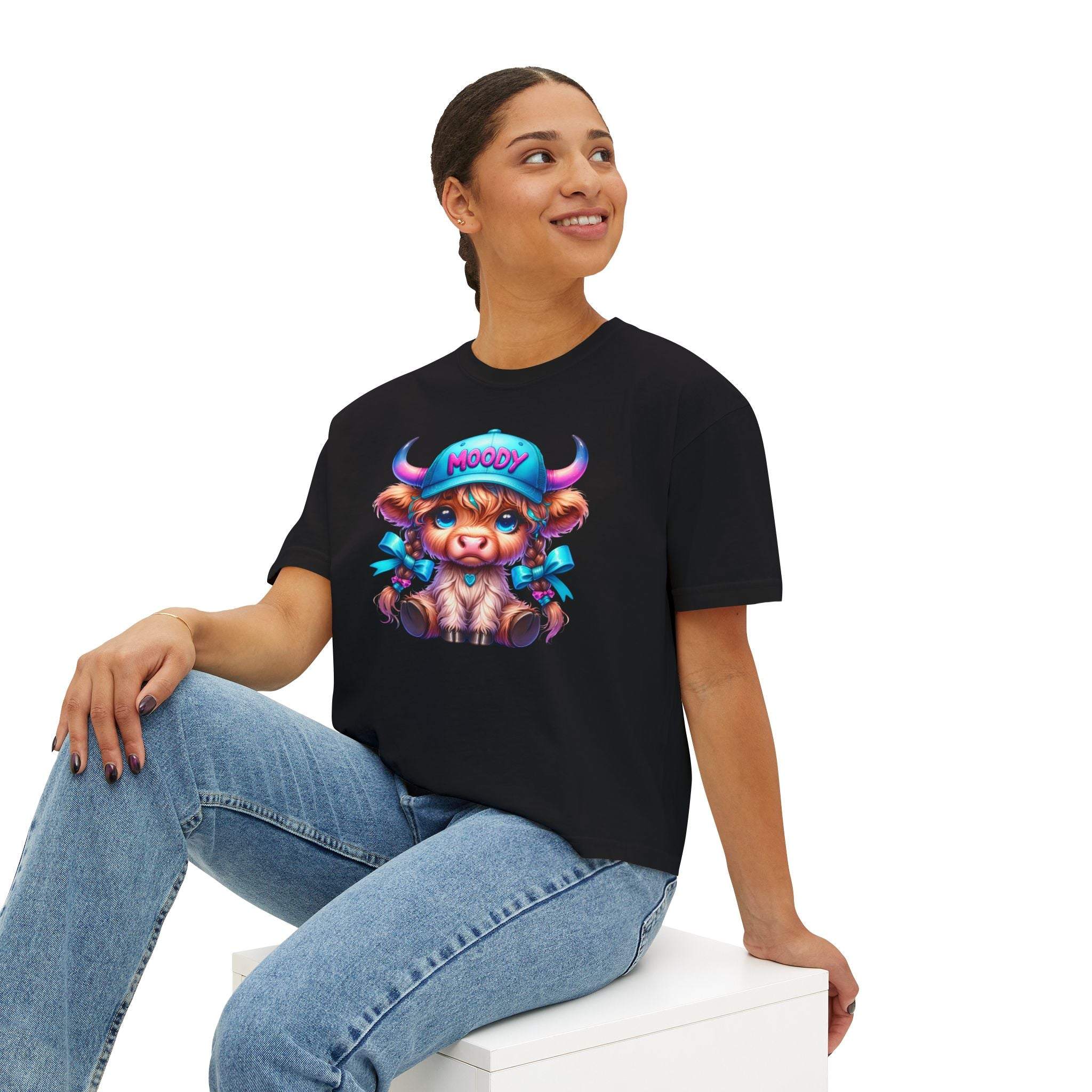 Women's black boxy tee with moody girl highland cow graphic design, casual and vintage style