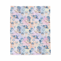 Coastal Cowgirl plush blanket draped over sofa with western design and soft fabric