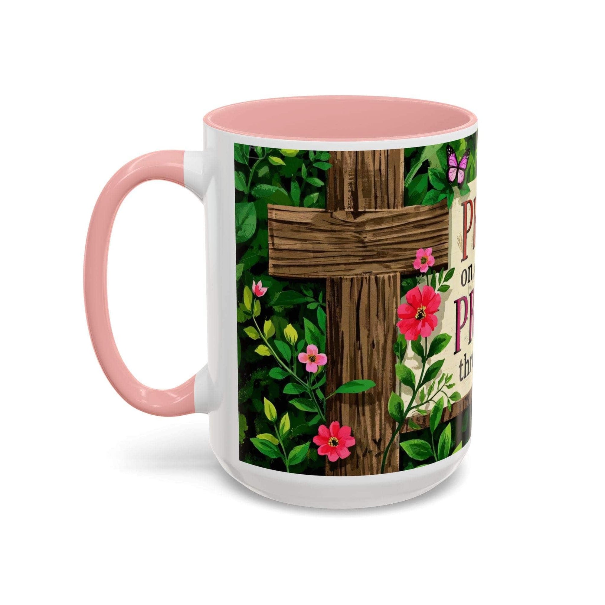Mug with floral design and pink handle on a white background