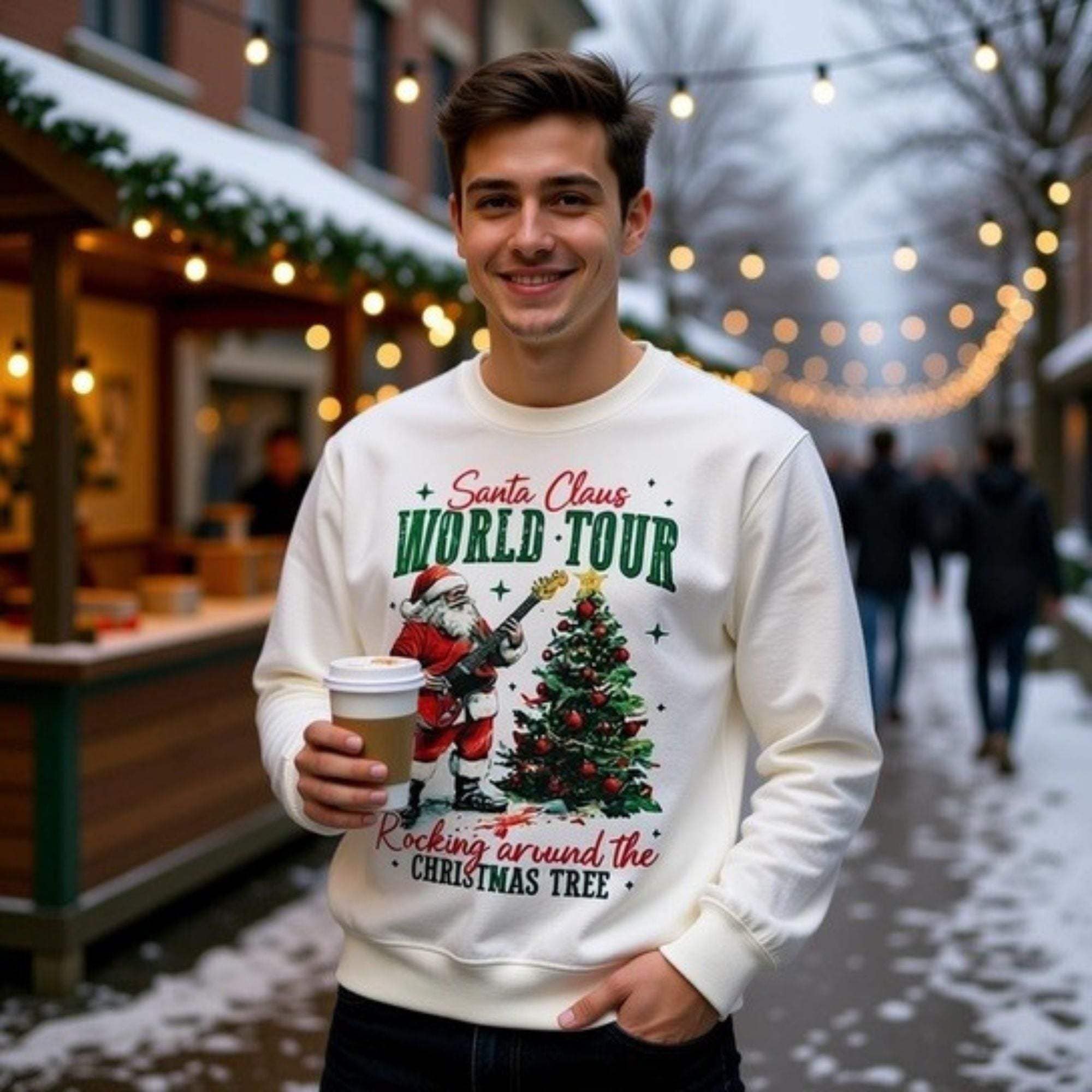Man wearing white Sweatshirt Rocking Santa with Christmas tree and Santa guitar design holding a coffee cup outdoors at night