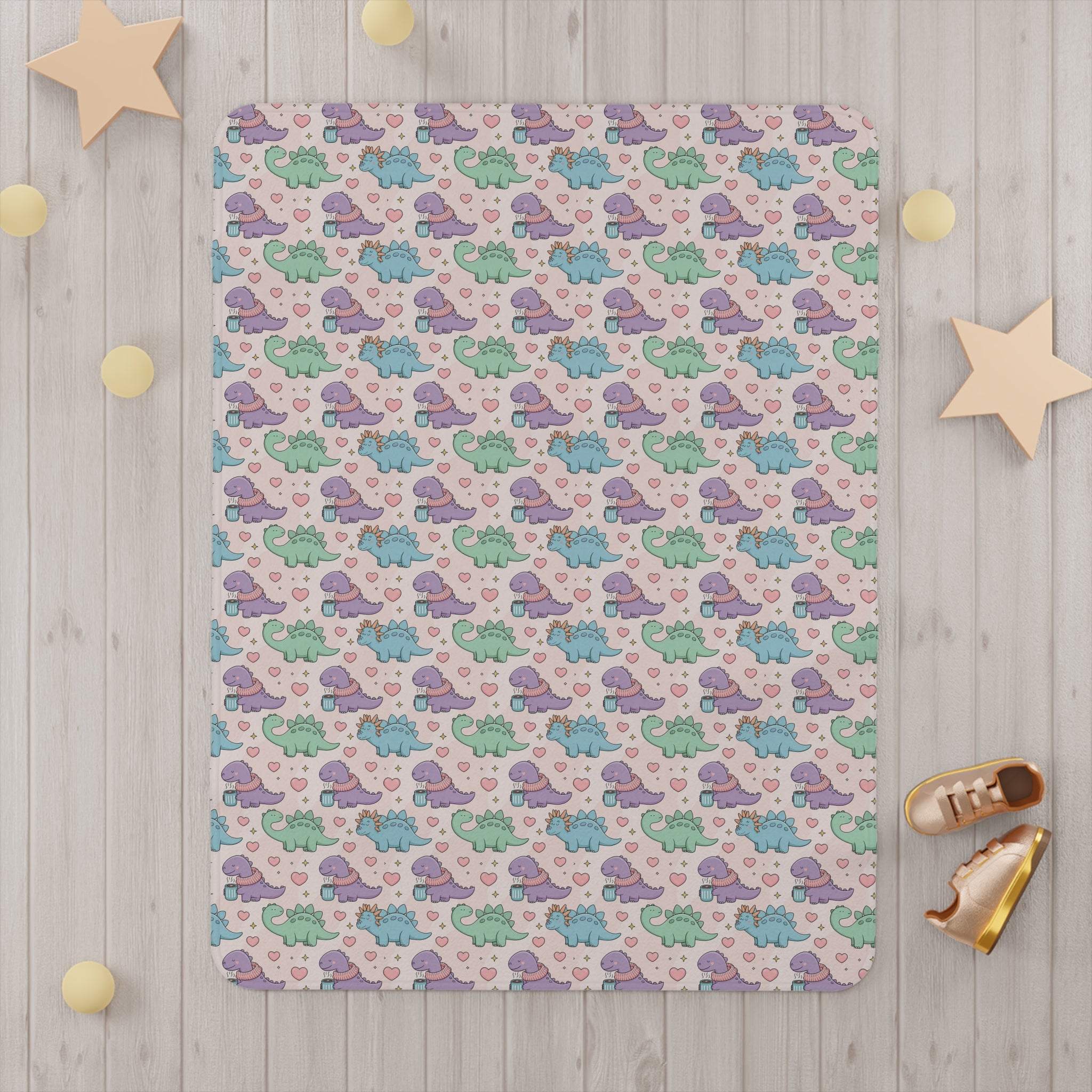 Toddler blanket with pastel dinosaurs wearing scarves on soft fleece material