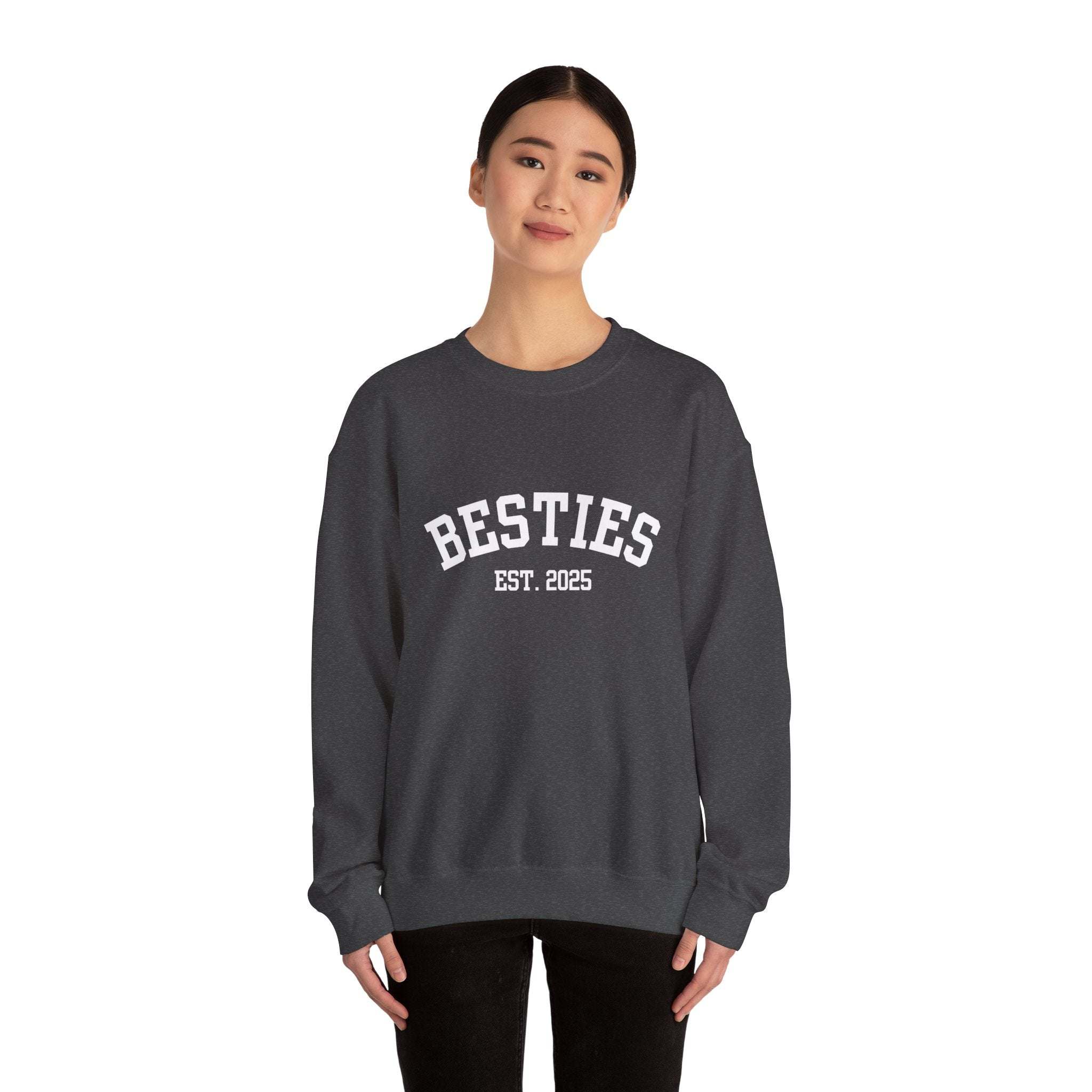 woman wearing black Varsity Besties Crewneck Sweatshirt with Besties Est. 2025 lettering