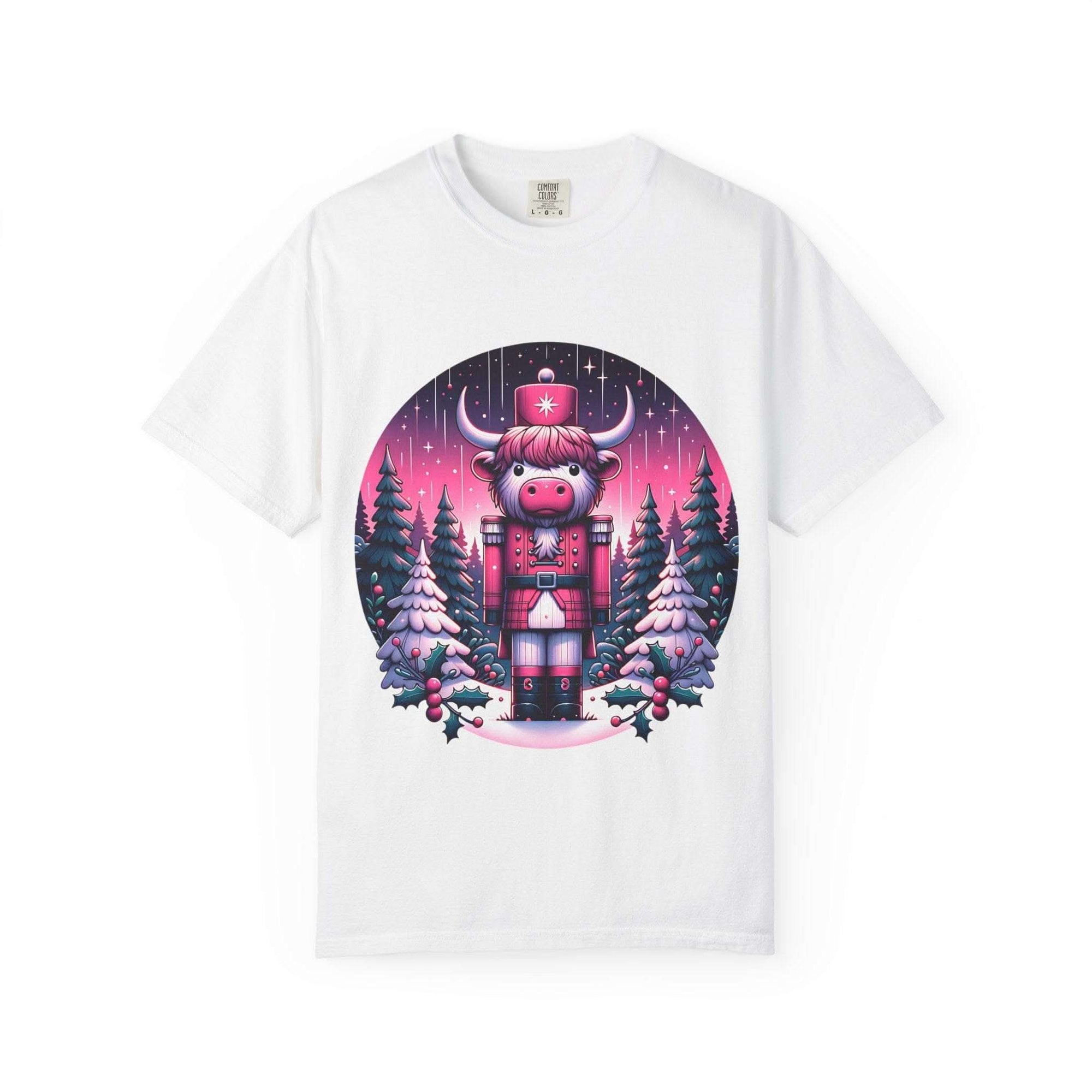 White Cow Nutcracker T-shirt with festive Highland cow nutcracker design and snowy pine trees background