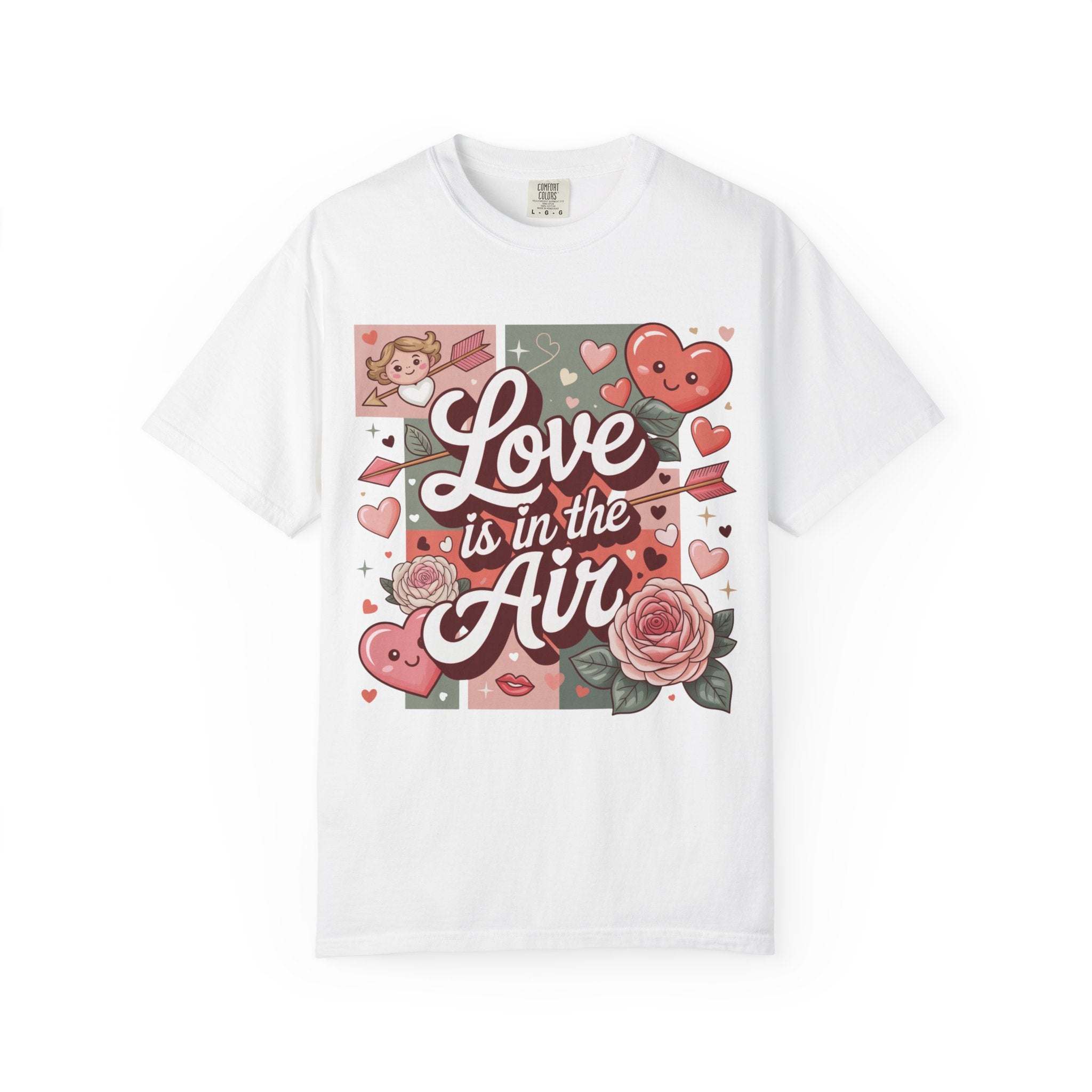 Valentine's themed garment-dyed t-shirt with hearts and love motifs, featuring "Love Is in the Air" design in soft vintage style