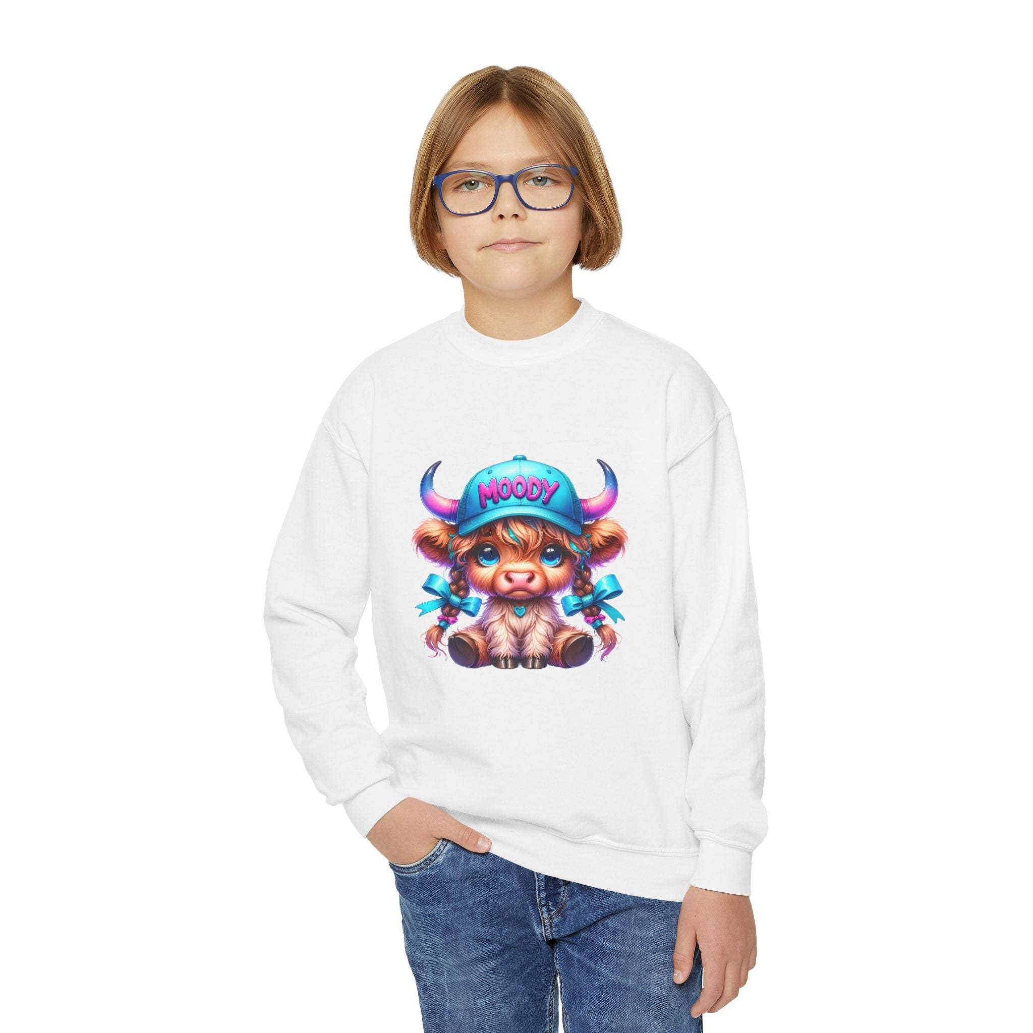 Child wearing white Moody Girl Highland Cow sweatshirt with colorful cartoon cow design on front