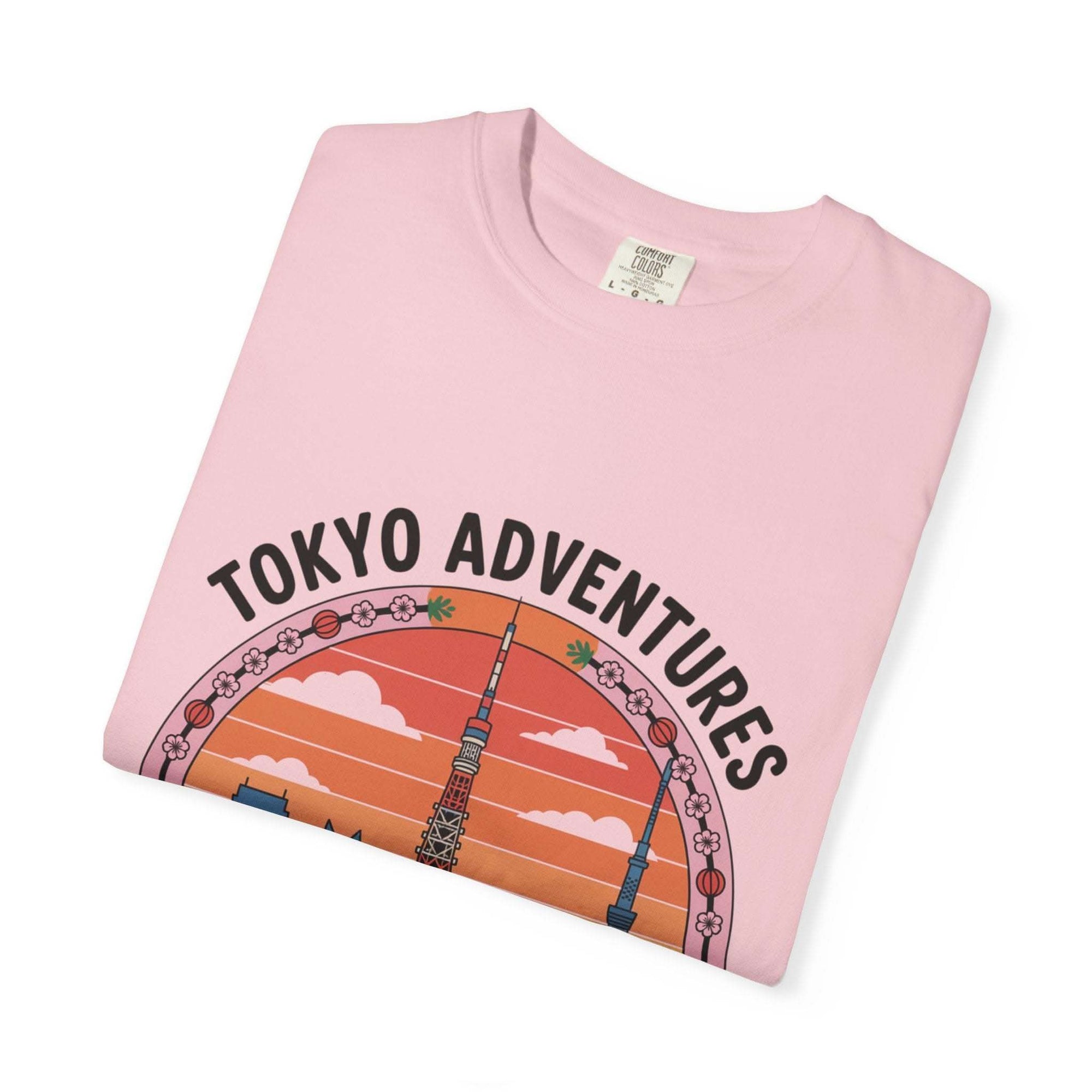 Pink garment-dyed T-shirt with Tokyo Adventures travel design and Japanese cultural elements