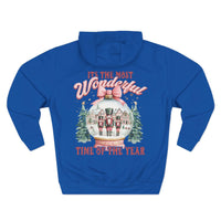 Blue fleece hoodie with vintage pink snow globe and nutcracker design for festive winter comfort