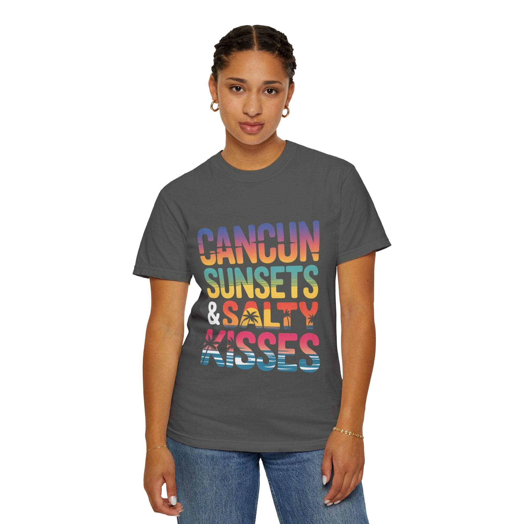 Person wearing a gray t-shirt with colorful text 'Cancun Sunsets & Salty Kisses' on a white background
