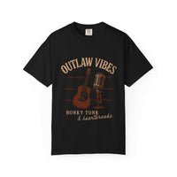 Black t-shirt with 'Outlaw Vibes' graphic design featuring a guitar, microphone, and barbed wire on a white background.