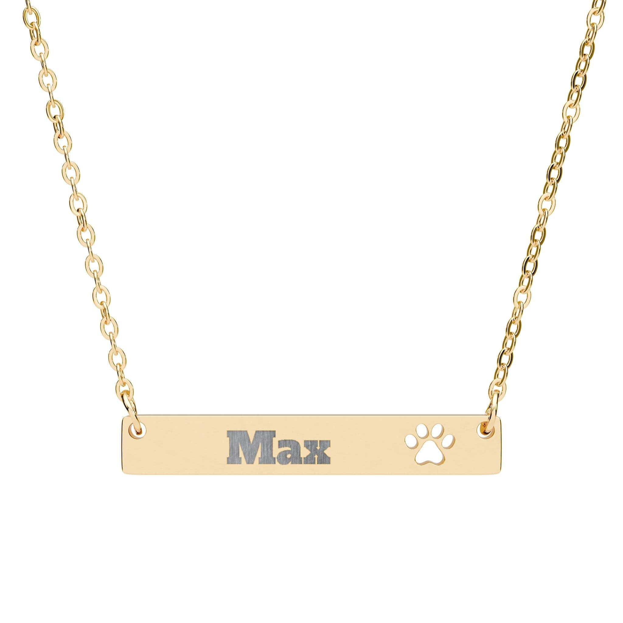 Gold necklace with 'Max' and a paw print on a white background