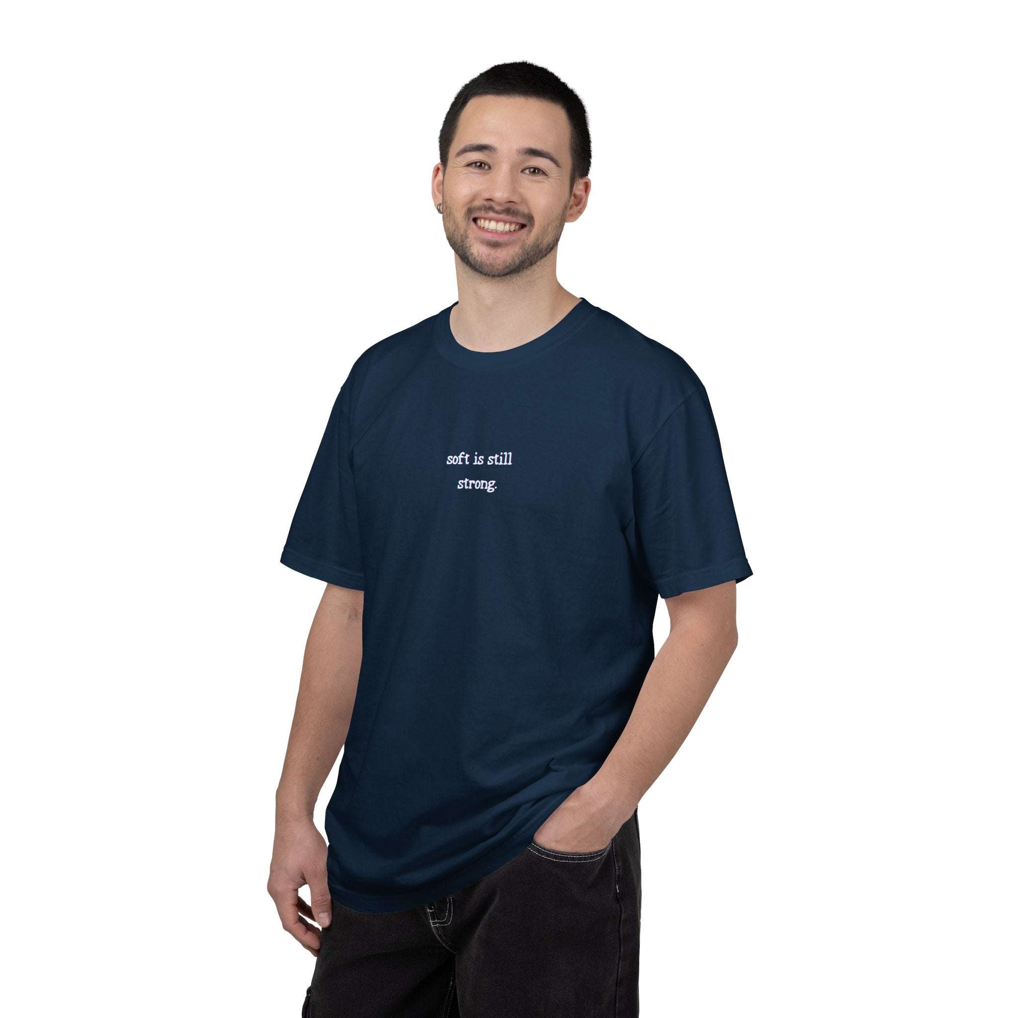 Man wearing a navy blue t-shirt with text on a white background