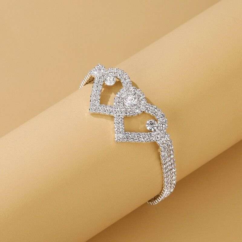 Double Heart Crystal Anklet with intertwined hearts and shimmering crystals for versatile summer wear