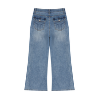 Woman wearing high-rise vintage wash wide leg jeans with a relaxed fit and straight hem