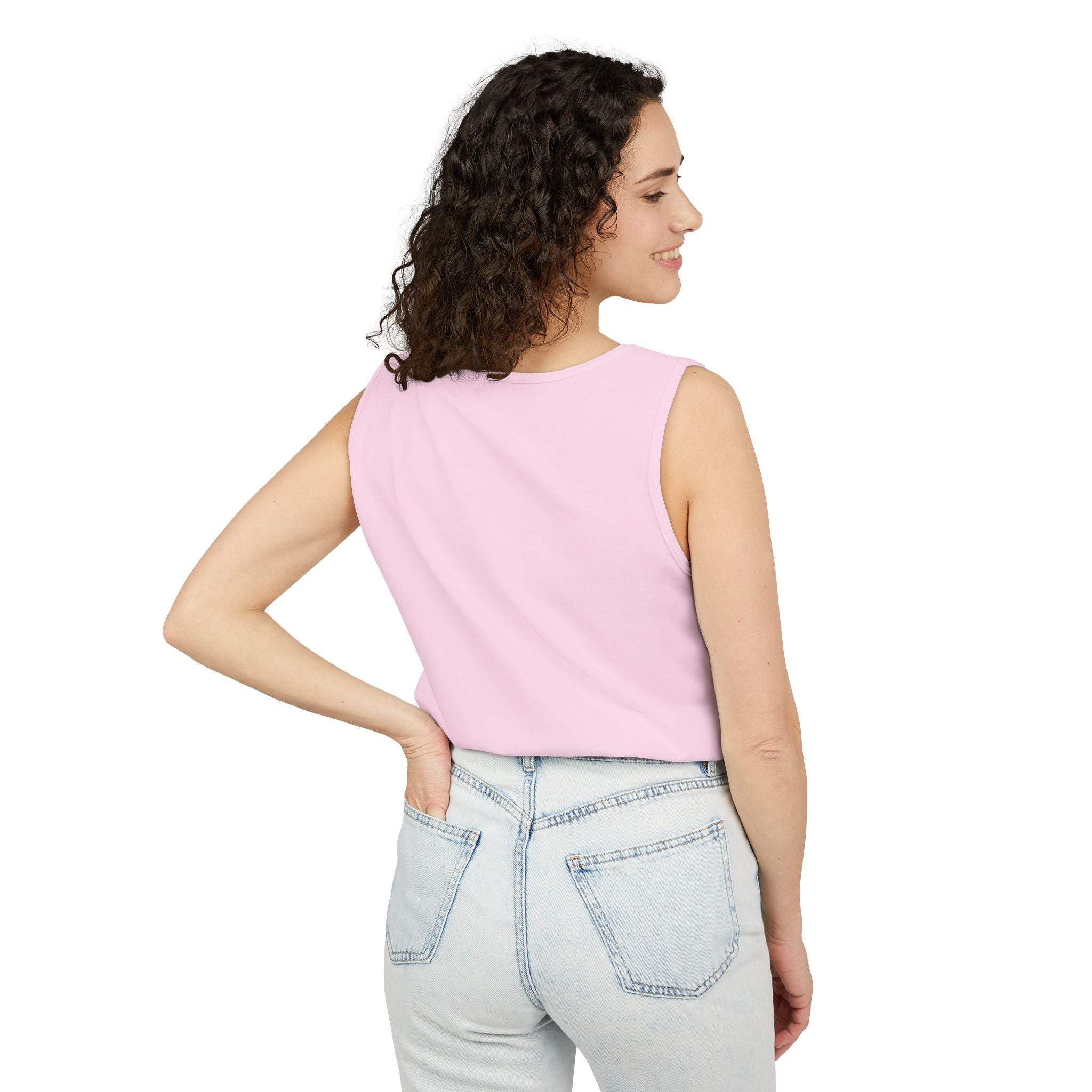 Woman wearing a light pink sleeveless tank top paired with light blue jeans showing the back view