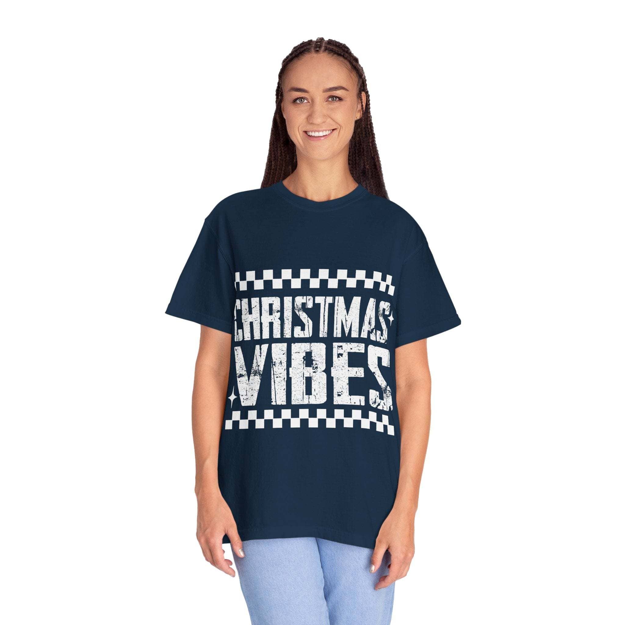 Woman wearing navy distressed Christmas Vibes graphic tee with relaxed fit and faded vintage style