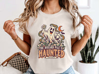 Model wearing ivory Comfort Colors 1717 Halloween mahjong T-shirt with a ghost holding a tile and “The Discard Pile Is Haunted (Obviously)” lettering.