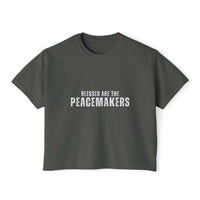 Women's boxy tee shirt with "Blessed be the Peacemakers" text in vintage pigment dye color