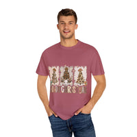 Man wearing maroon Cowboy Howdy Christmas t-shirt with festive holiday trees design