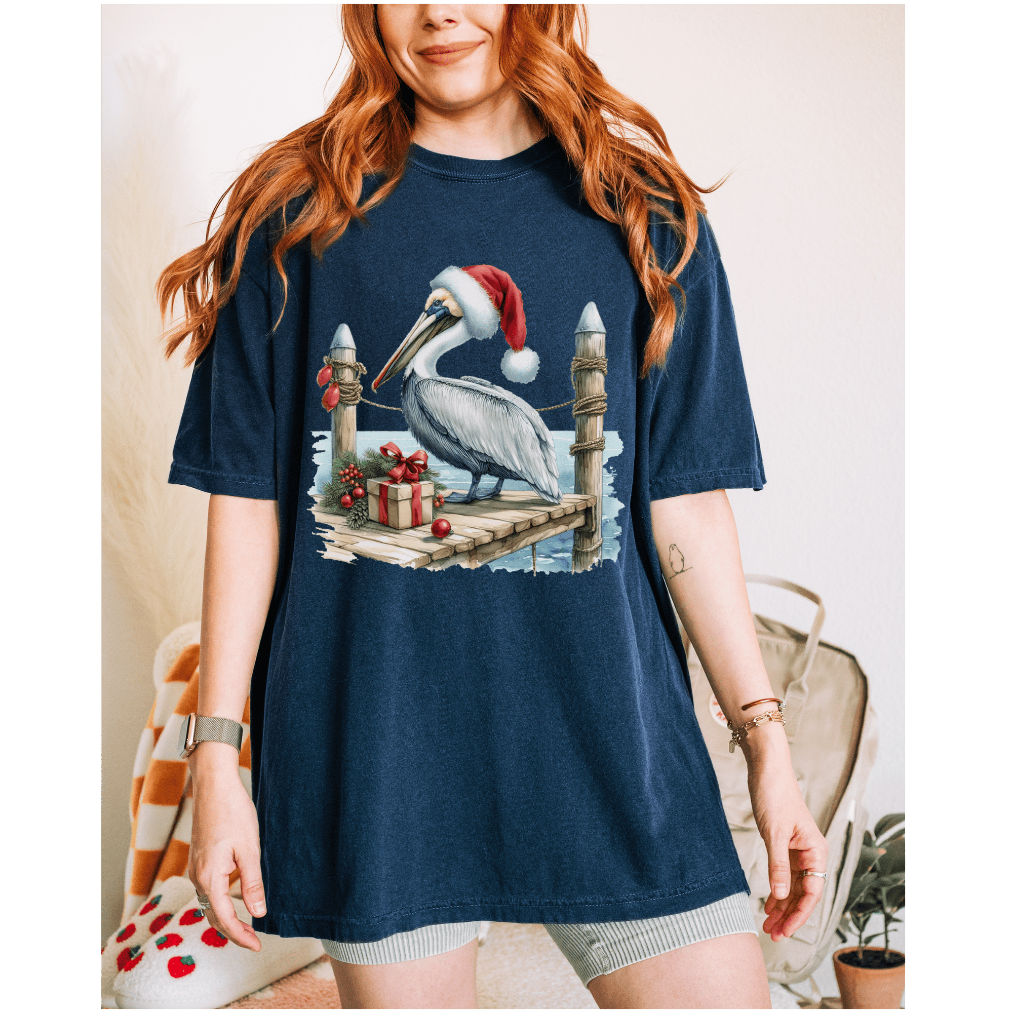 Christmas Pelican Santa T-Shirt with pelican dressed as Santa Claus on festive beach holiday tee