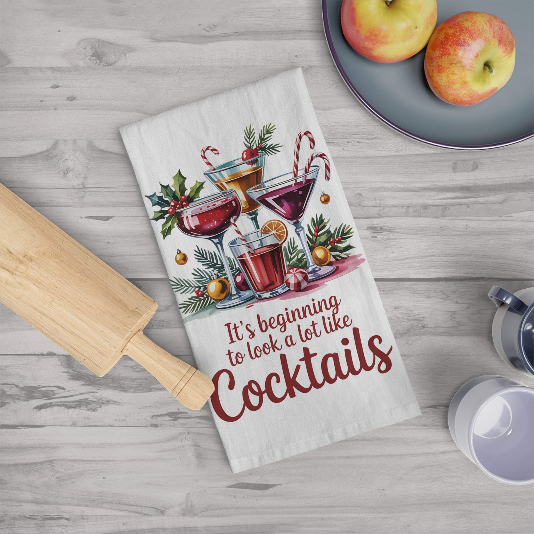 Cotton tea towel with festive cocktail design and "It's beginning to look a lot like cocktails" text