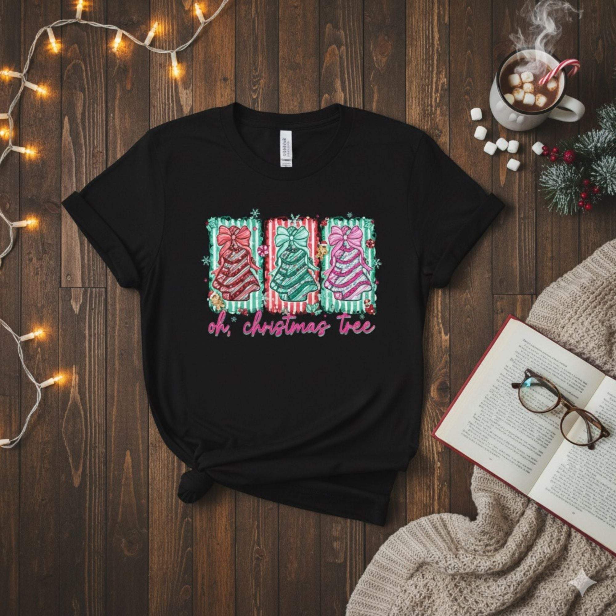 Black Oh Christmas Tree T-shirt with colorful festive tree design and text, styled for holiday season.