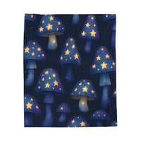 Plush blanket with whimsical mushroom designs and glowing stars for cozy comfort