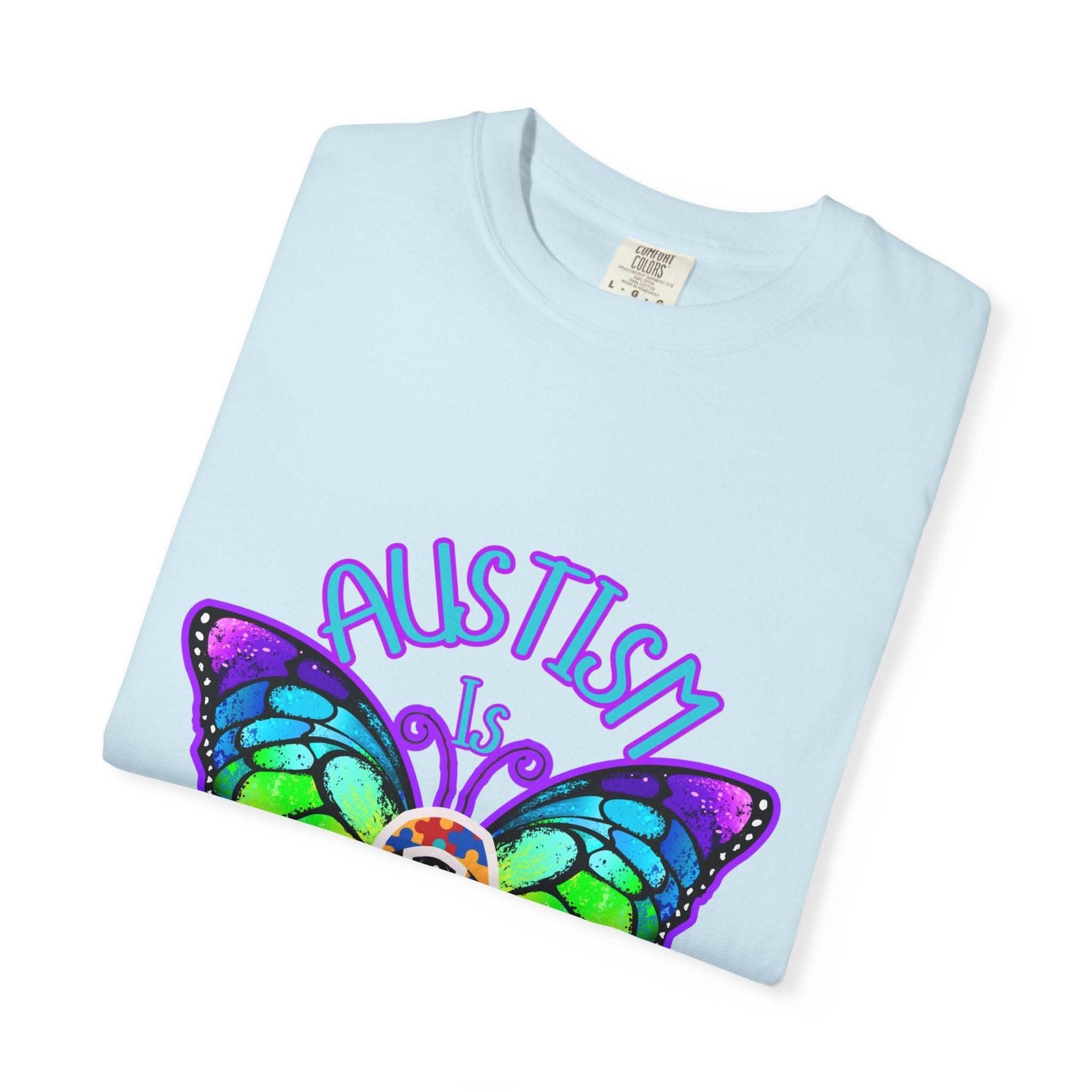 Light blue Autism is Beautiful T-shirt with colorful butterfly design promoting autism awareness and acceptance