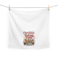 White cotton tea towel featuring 'Christmas Baking Crew' design, ideal for festive kitchen decor