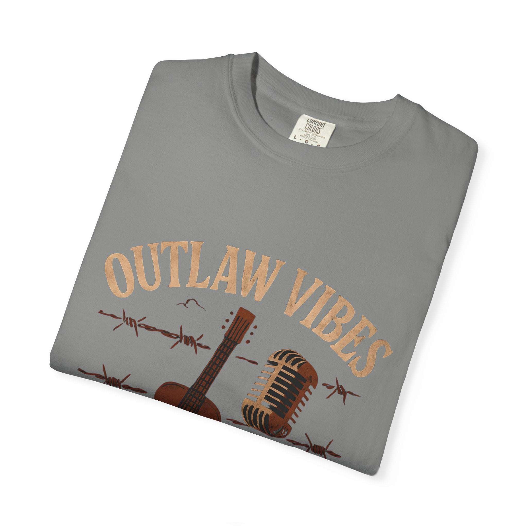 Folded gray t-shirt with 'Outlaw Vibes' text and guitar graphic on a white background