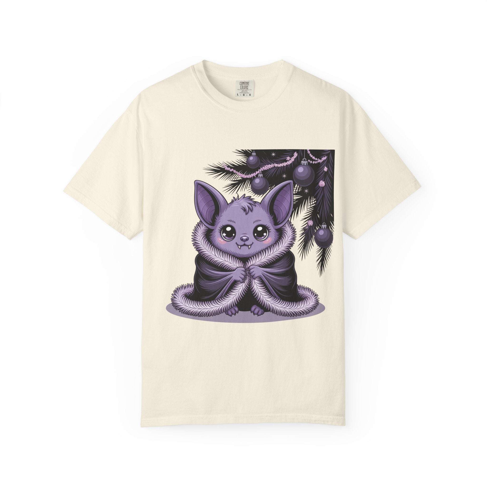 Beige t-shirt with a purple creature graphic on a white background
