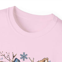 White t-shirt with retro patchwork reindeer design wearing blue scarf and surrounded by snowflakes
