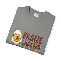 White cotton t-shirt featuring 'Praise the Lord, Devil the Eggs' design, perfect for Easter and Christian apparel.