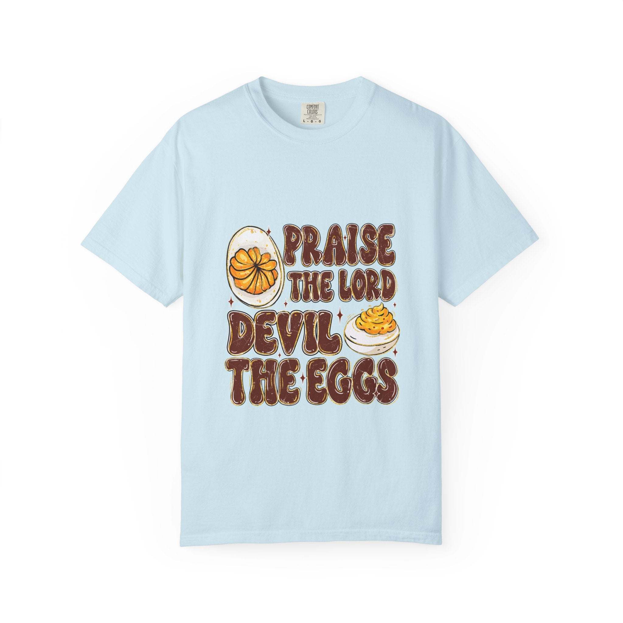 White cotton t-shirt featuring 'Praise the Lord, Devil the Eggs' design, perfect for Easter and Christian apparel.