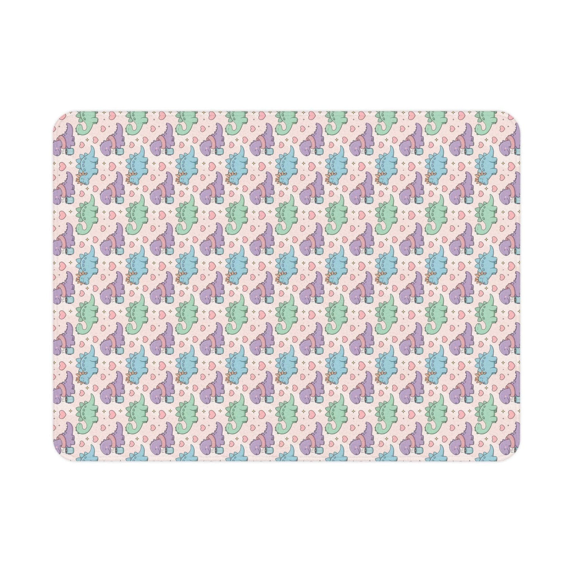 Pastel dinosaur pattern toddler blanket with soft fleece and vibrant colors for cozy comfort