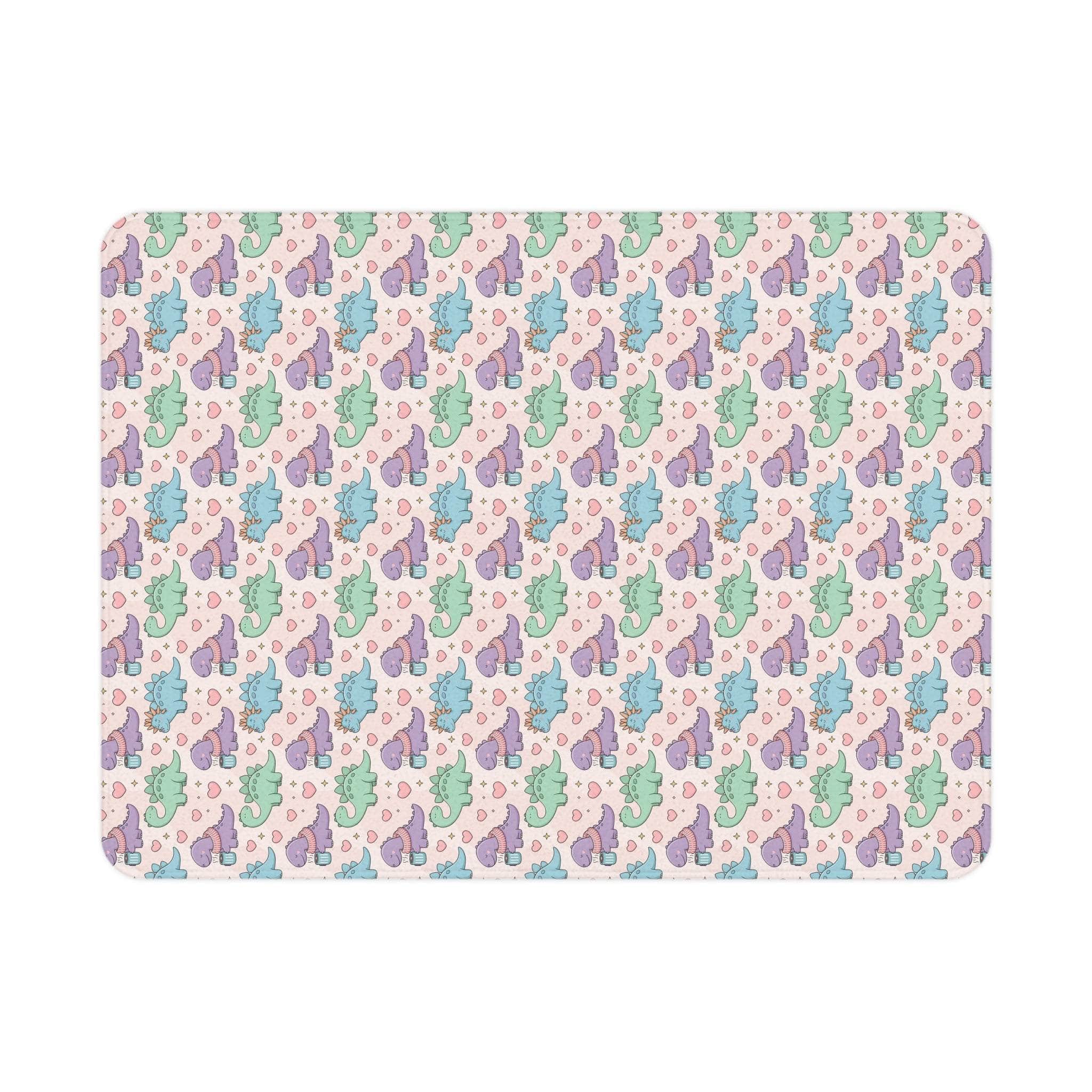 Pastel dinosaur pattern toddler blanket with soft fleece and vibrant colors for cozy comfort