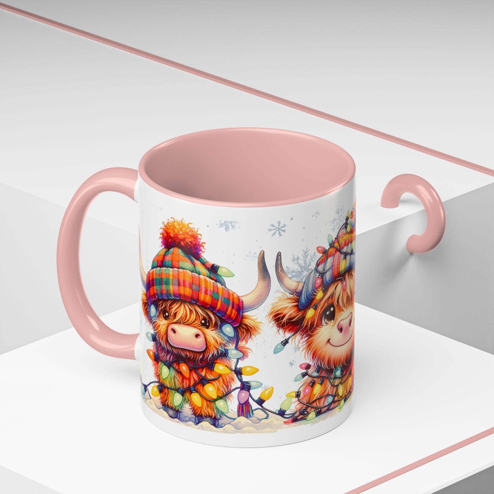 Mug with pink interior and handle featuring Highland cow design on a white background