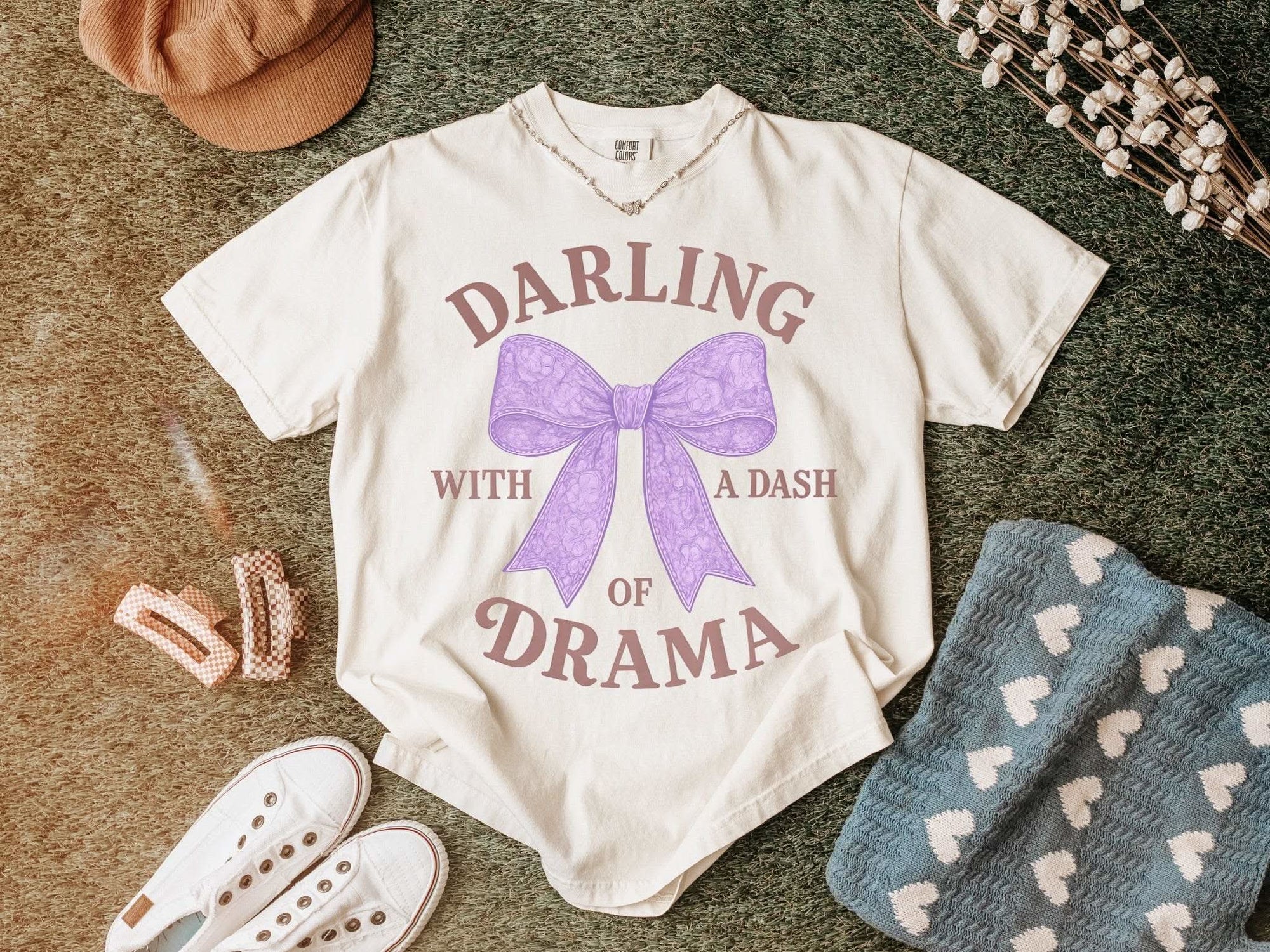 Darling With a Dash of Drama garment-dyed t-shirt in muted colors with soft, playful design and casual elegance