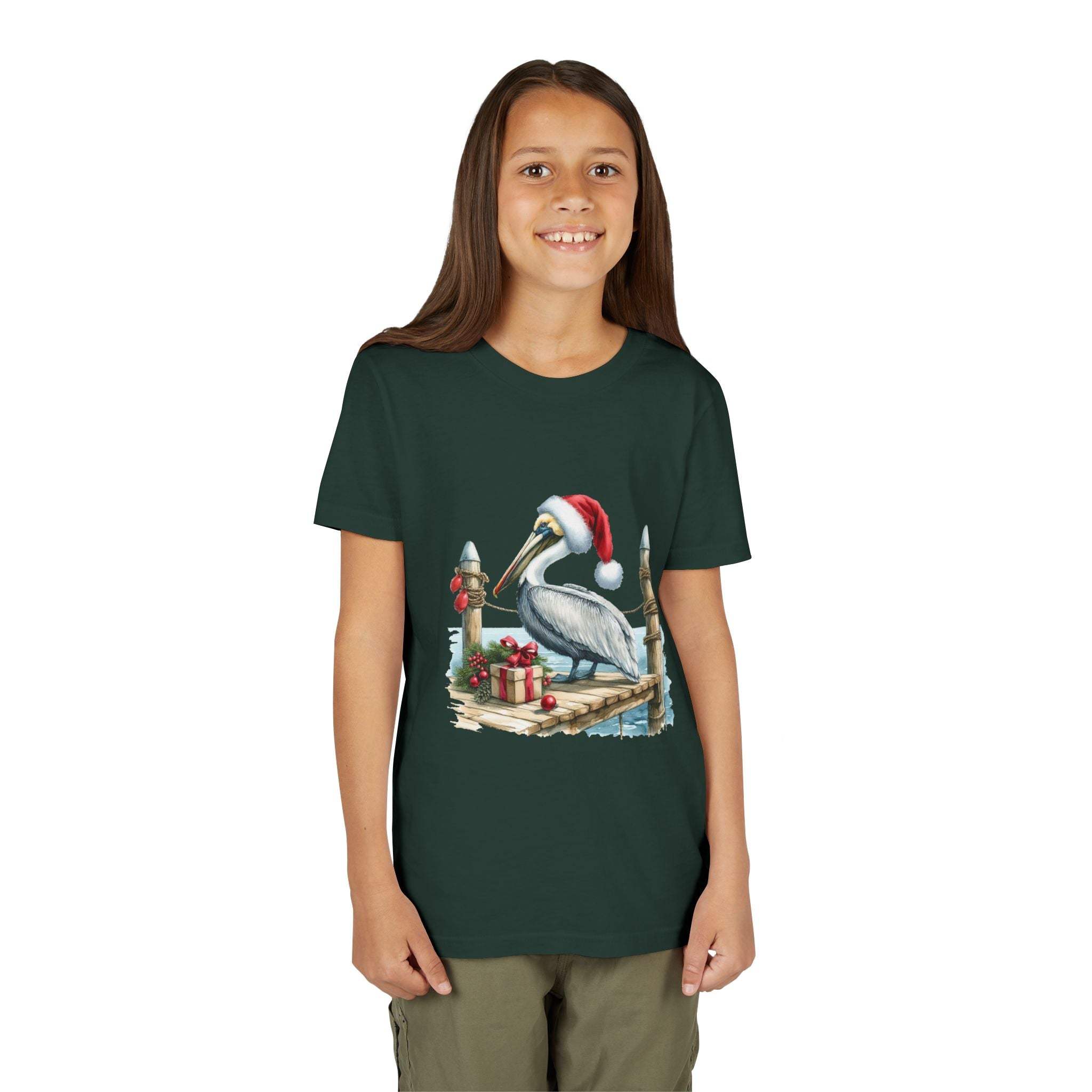 Youth t-shirt featuring a pelican wearing a Santa hat on a pier with holiday gifts, coastal Christmas design