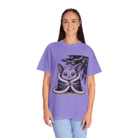 Person wearing a purple t-shirt with a cute creature design on a white background