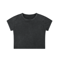 Woman wearing snow washed crop top with round neck and drop shoulder sleeves in casual streetwear style